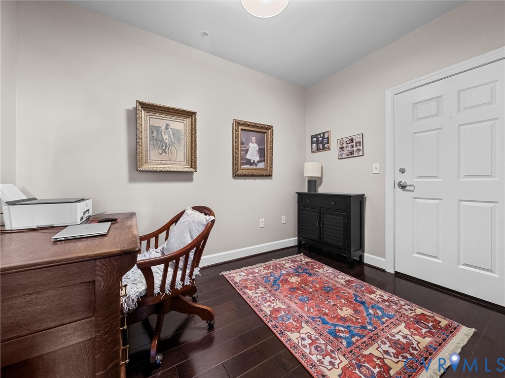 Bedroom 3. Currently used as an office, double closet and door to second elevator.