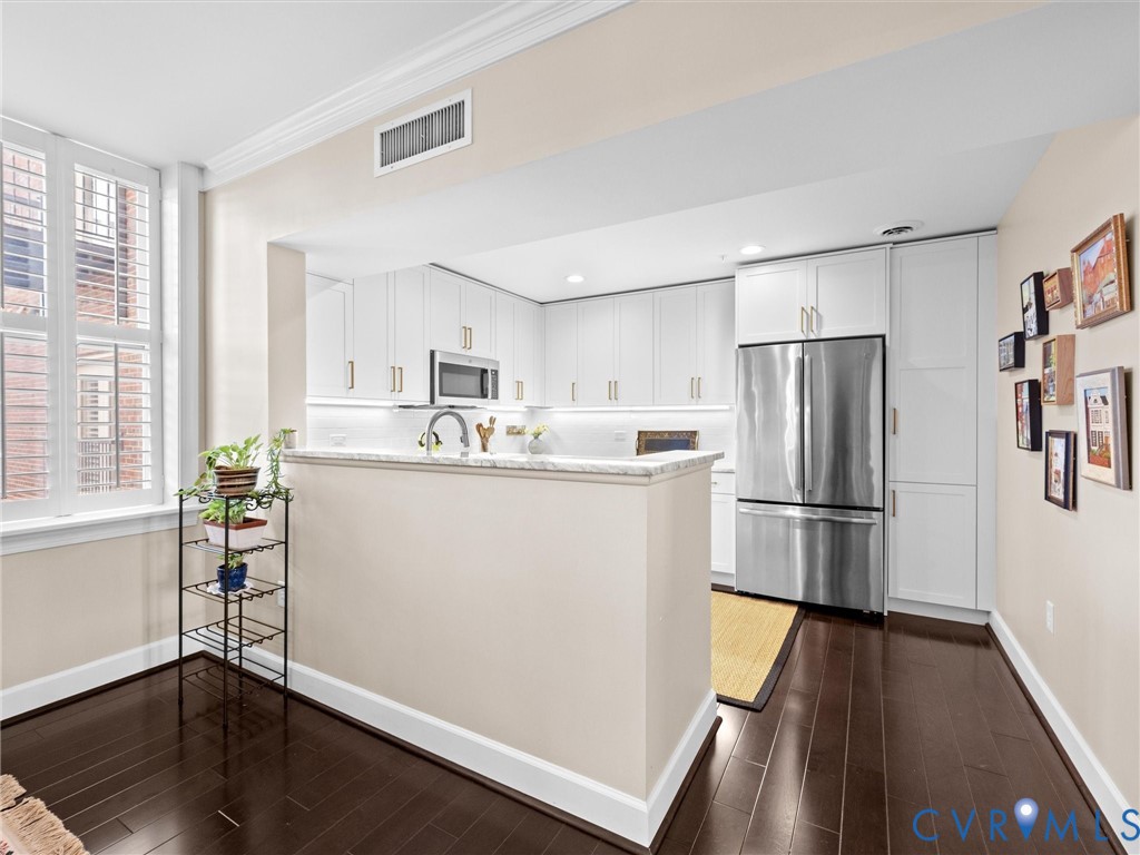 Kitchen opens to dining room.