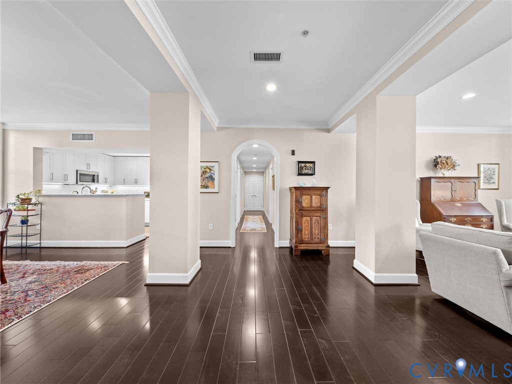 Welcoming light-filled entry hall flanked by a living room and dining room. Welcoming light-filled entry hall flanked by a living room and dining room.