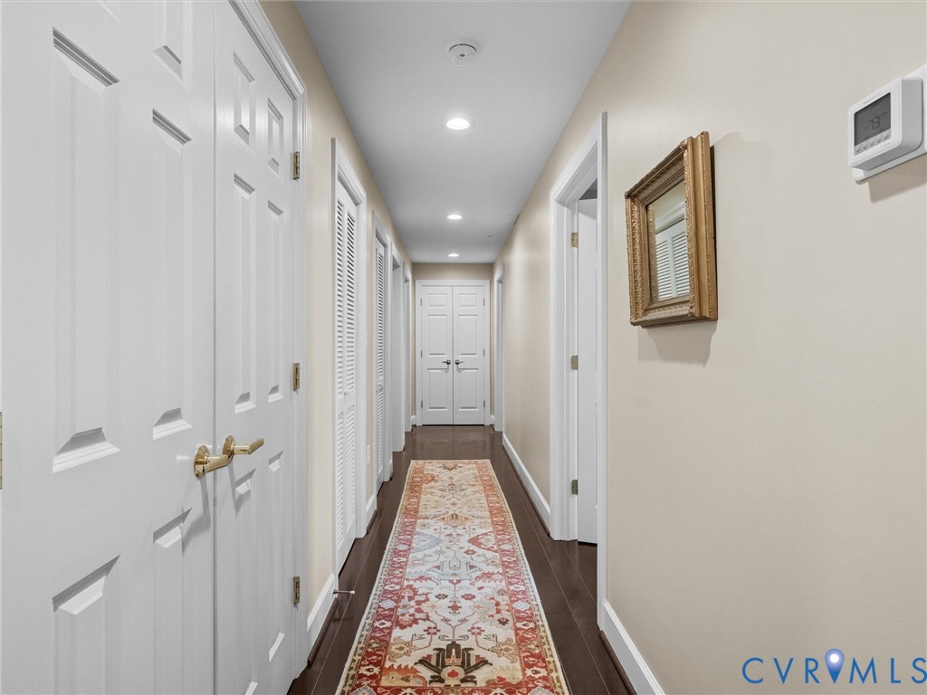 Hallway has coat closet  and linen closet.