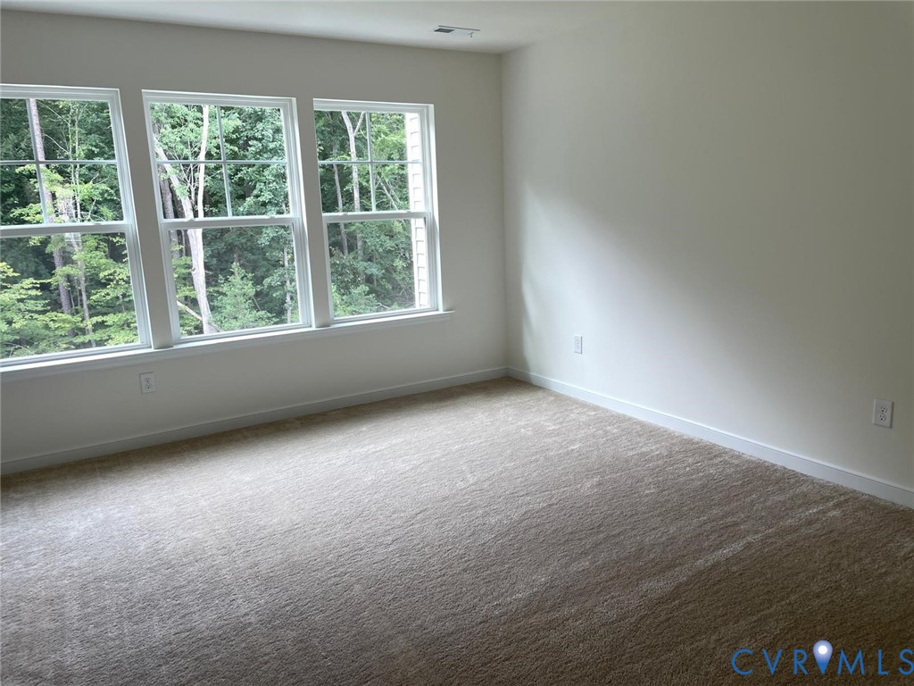 View of carpeted spare room