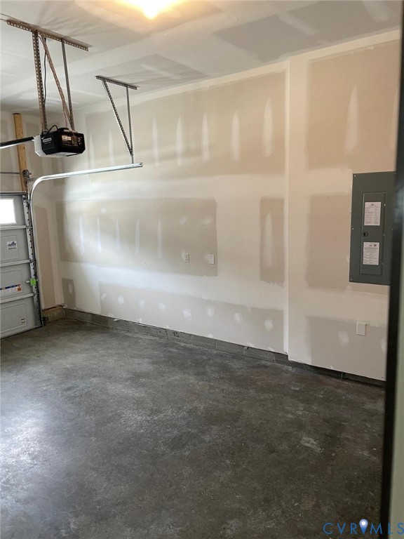 Garage with a garage door opener and electric panel
