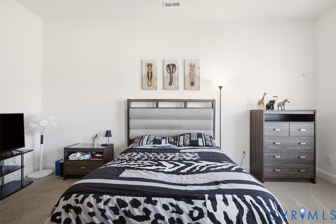 Neutral wall finish and wall-to-wall carpeting