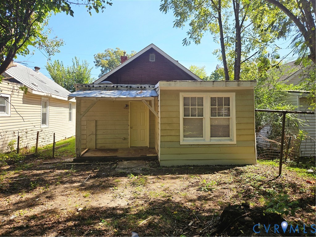 Exterior featuring horizontal siding, a covered porch, and double-hung windows Exterior featuring horizontal siding, a covered porch, and double-hung windows