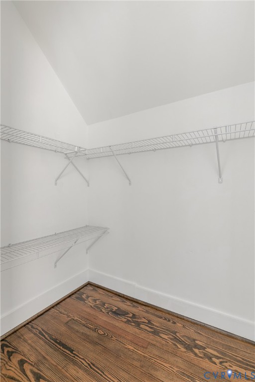 Storage area featuring wood-finish flooring and white wire shelving