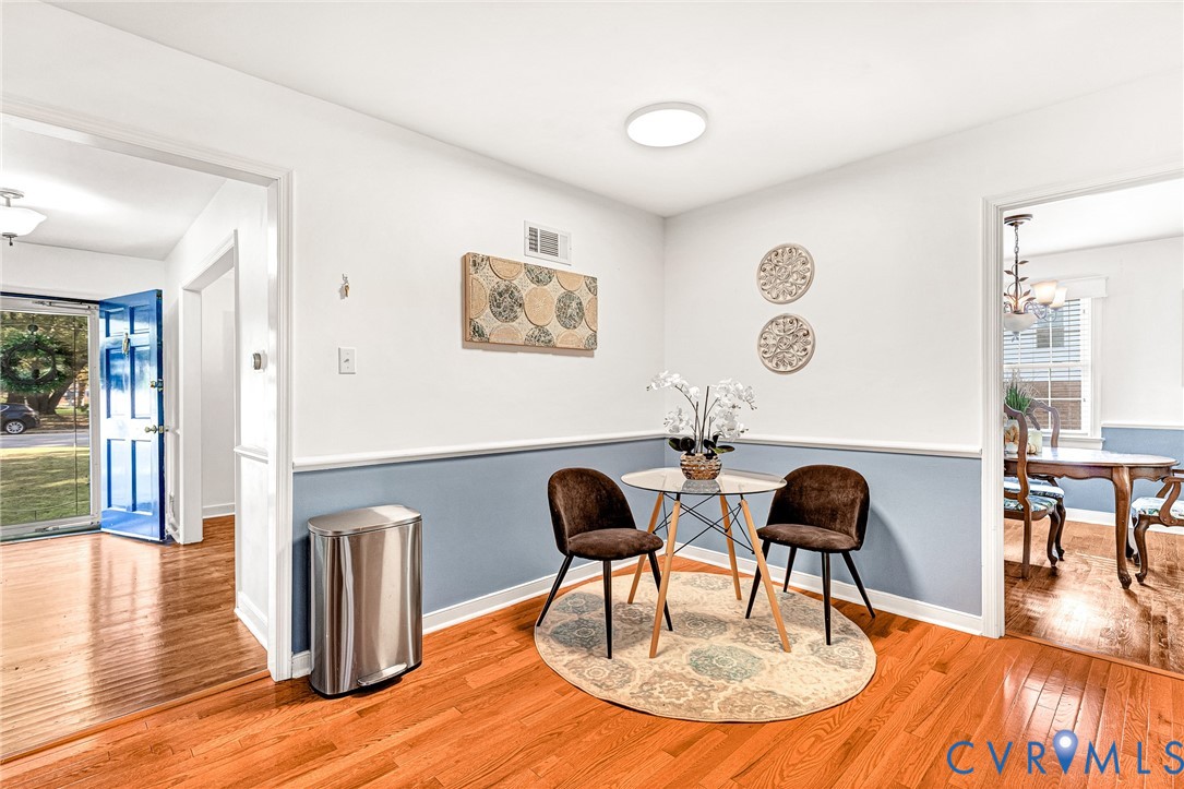 Wood-finish flooring, chair rail molding, and neutral wall paint