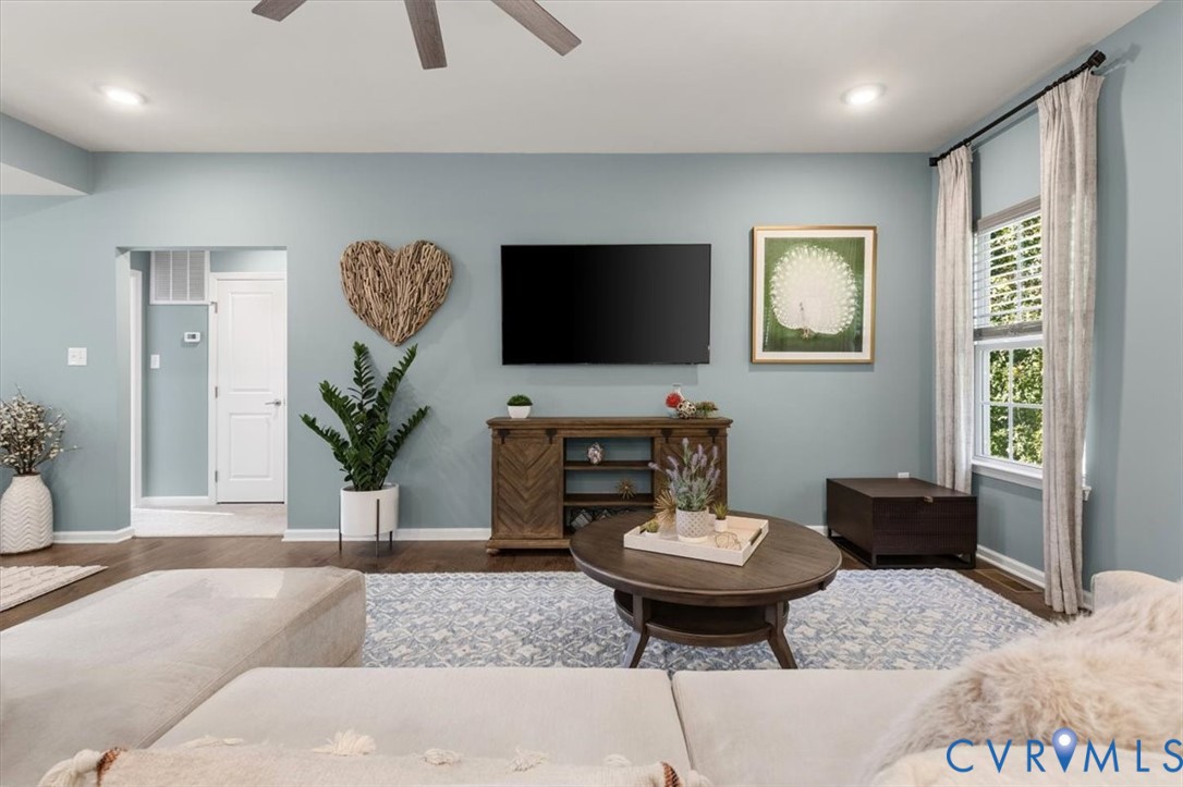 Open Concept living room.  Recessed Lights and ceiling fan, new scratch proof high end LVP