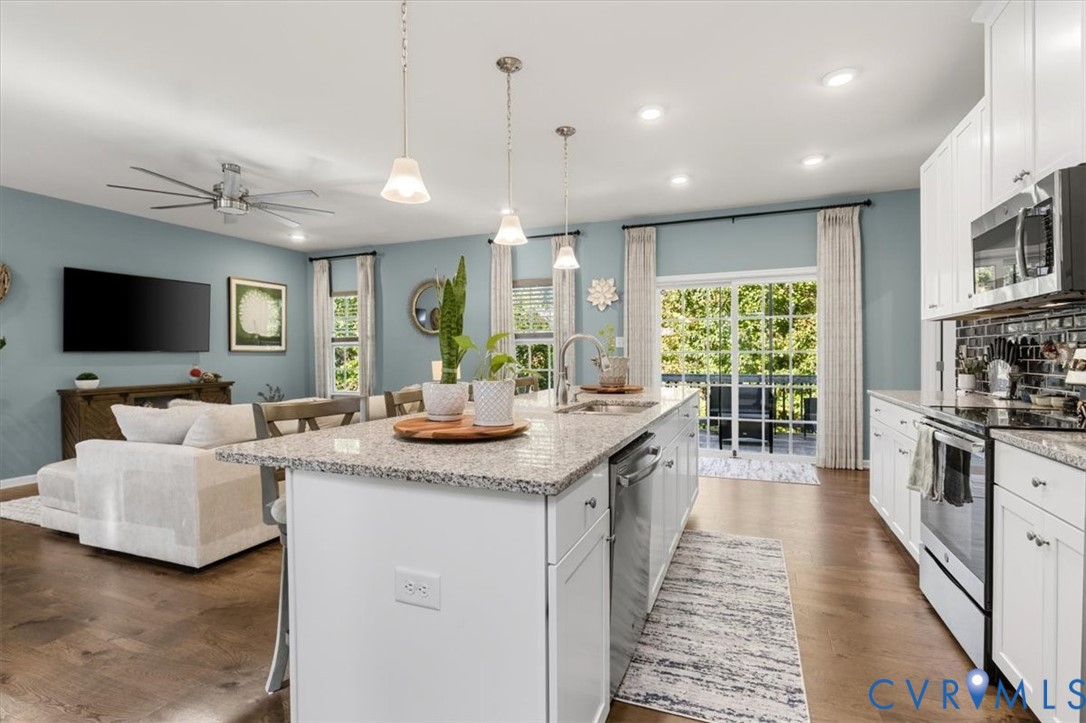 Open to the living room, Granite Counters, pantry, large island, new scratch proof high end LVP