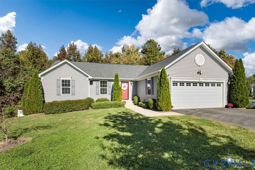 Manicured front yard with irrigation and ample parking