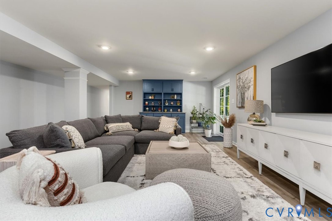 Finished basement living area, recessed lighting, Open Concept, new high end LVP