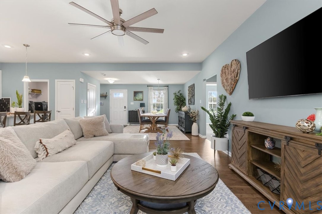Open Concept living room.  Recessed Lights and ceiling fan, new scratch proof high end LVP