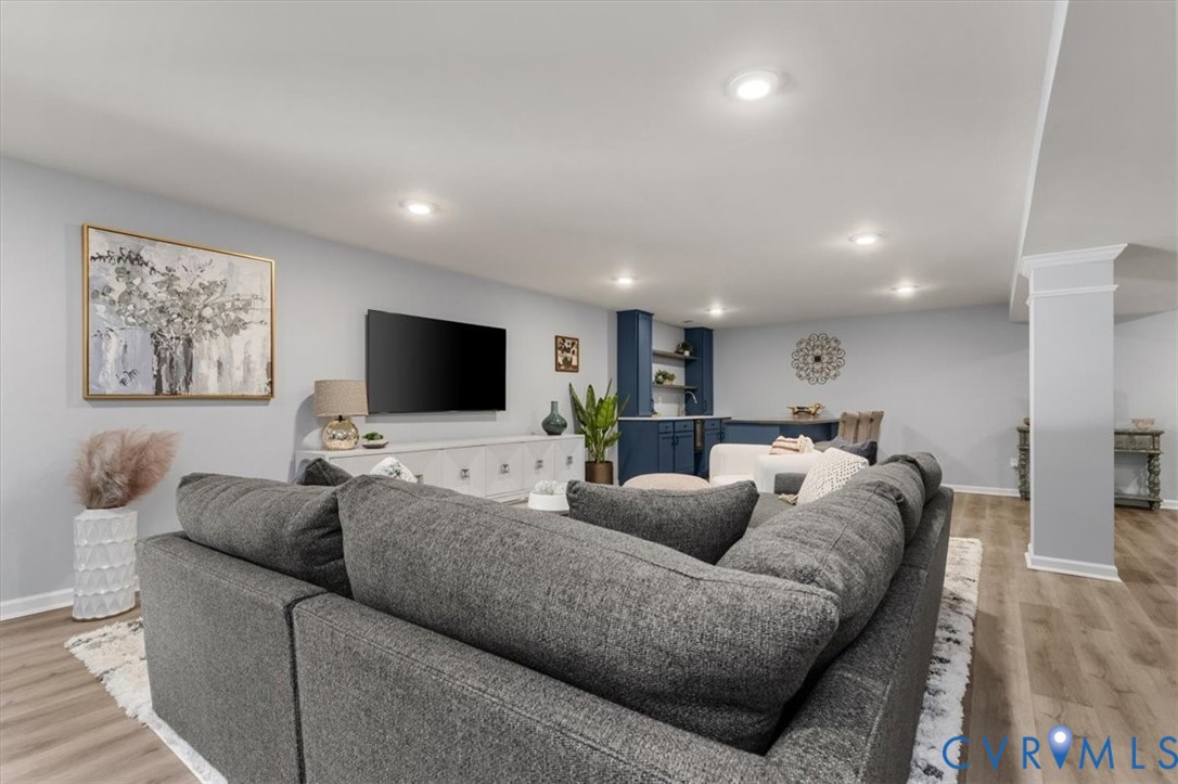 Finished basement living area, recessed lighting, Open Concept, new high end LVP