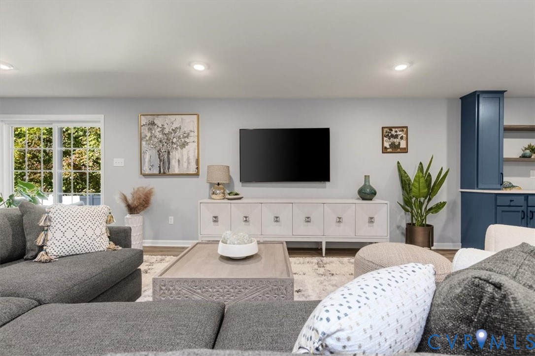 Finished basement living area, recessed lighting, Open Concept, new high end LVP