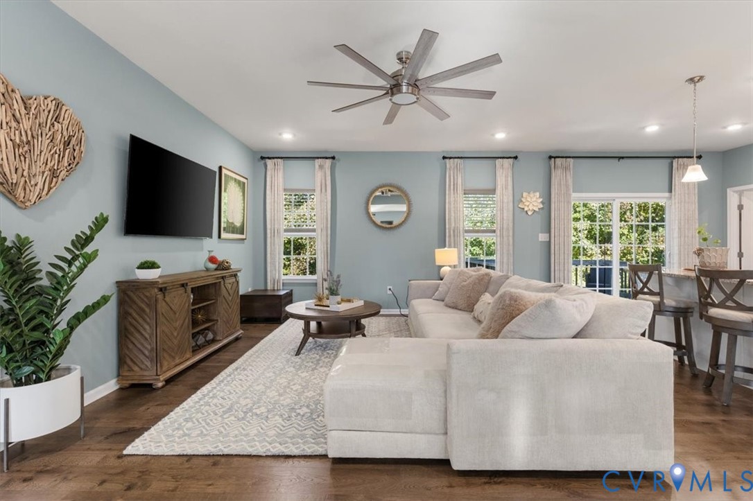 Open Concept living room.  Recessed Lights and ceiling fan, new scratch proof high end LVP