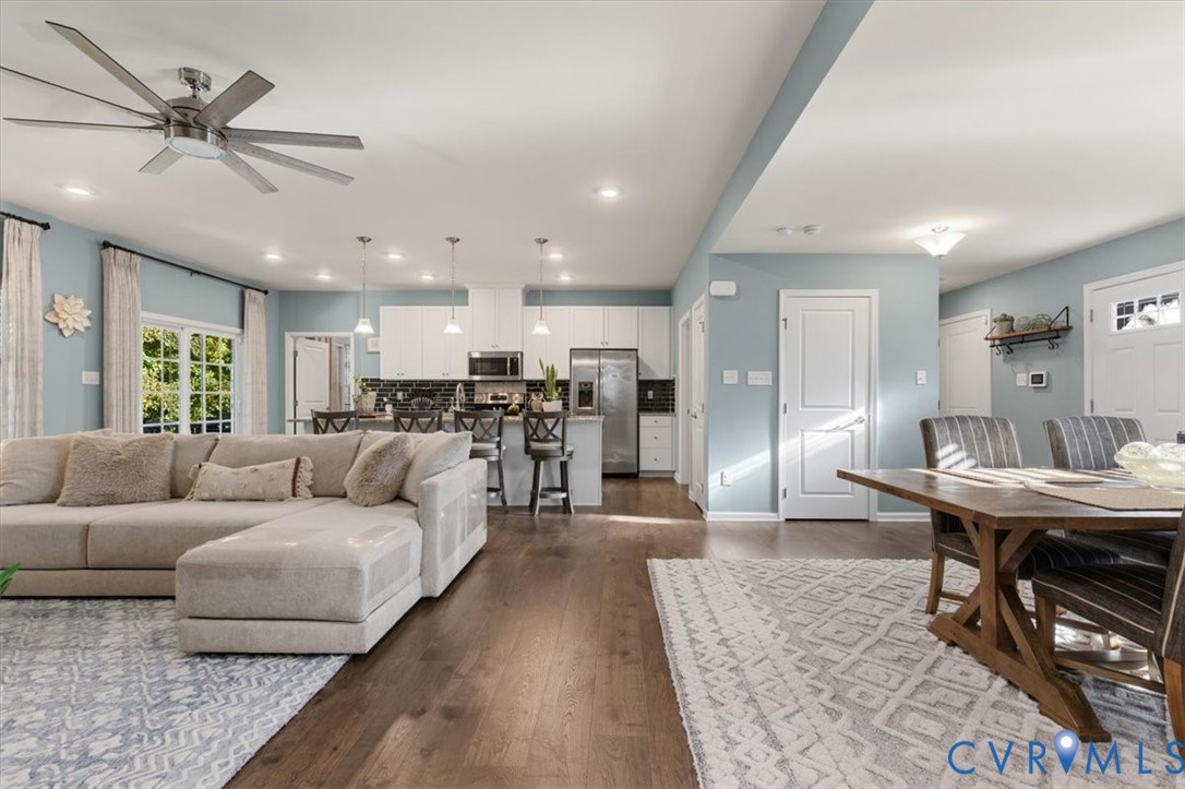 Open Concept living room.  Recessed Lights and ceiling fan, new scratch proof high end LVP