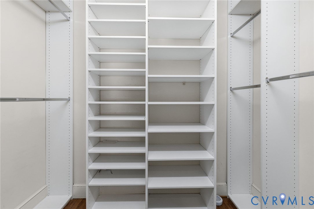 One of Two Walk-in closets with built-ins in Primary Bedroom