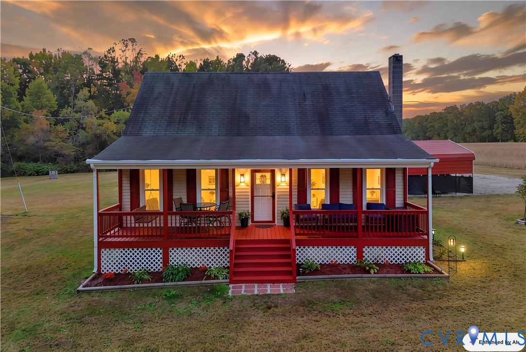 Gabled exterior featuring a covered front porch, red wood-finish decking, lattice skirting, and a chimney