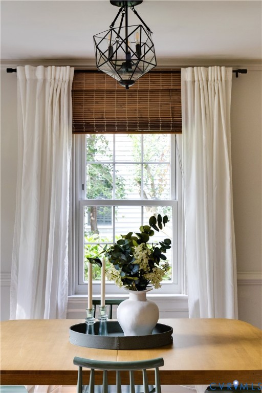 Multi-pane double-hung window featuring a dark geometric metal pendant light fixture