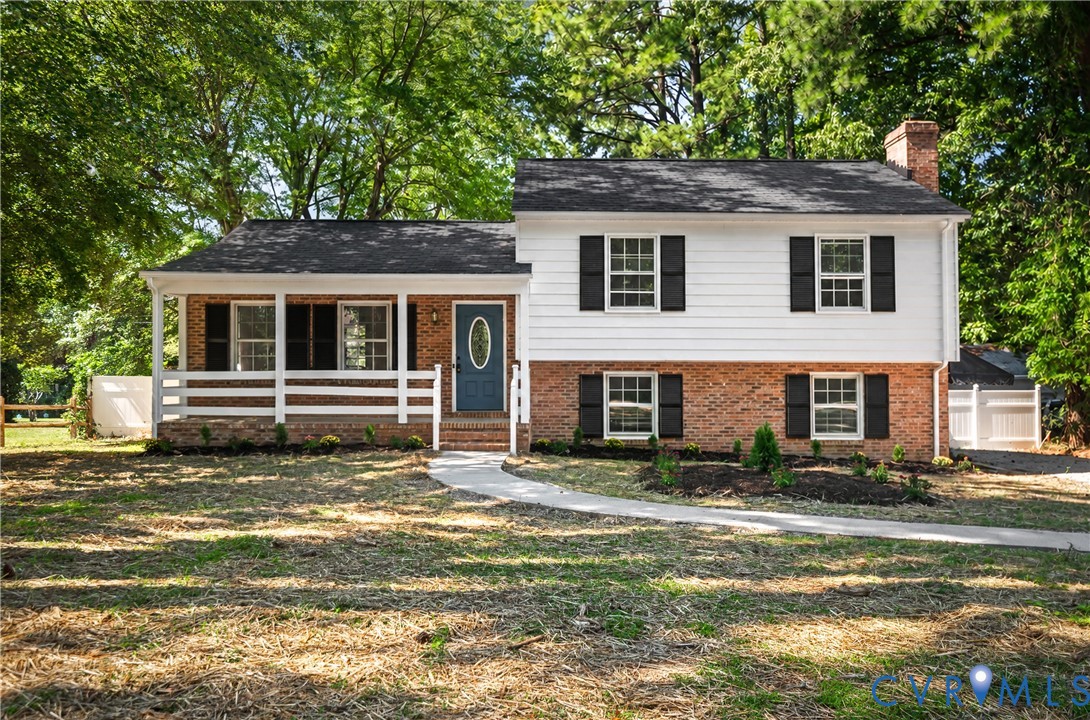 2026 Roof, Two-story exterior featuring a brick and horizontal siding facade, a covered front porch with a white rail, and a prominent chimney 2026 Roof, Two-story exterior featuring a brick and horizontal siding facade, a covered front porch with a white rail, and a prominent chimney