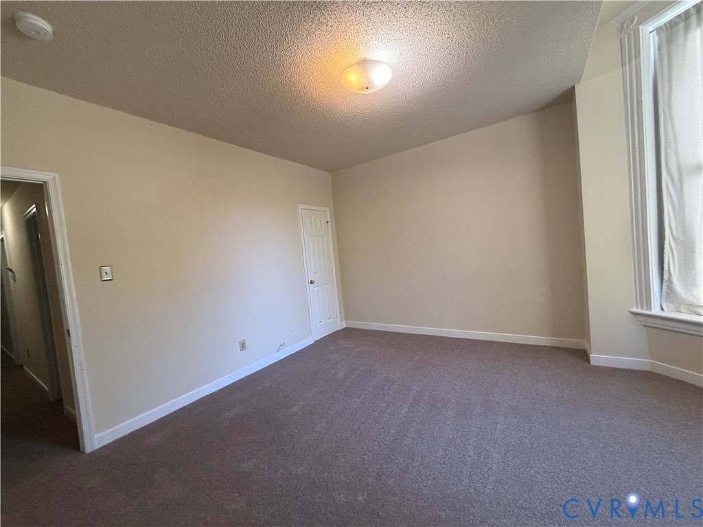 Bedroom 1 faces the street and has blackout curtains