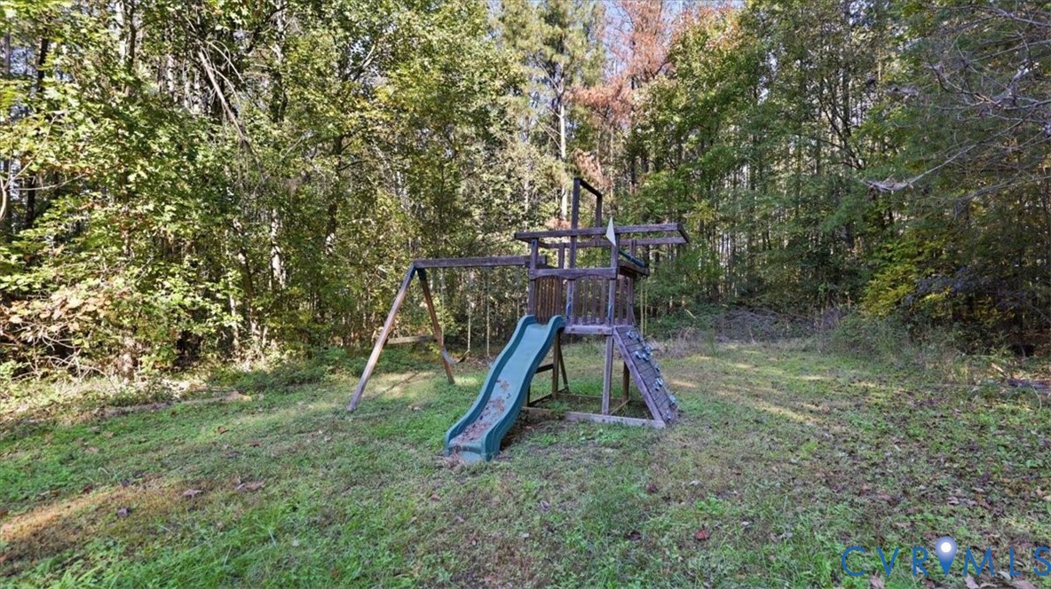 Wooded backyard parcel featuring mature trees and established natural landscape