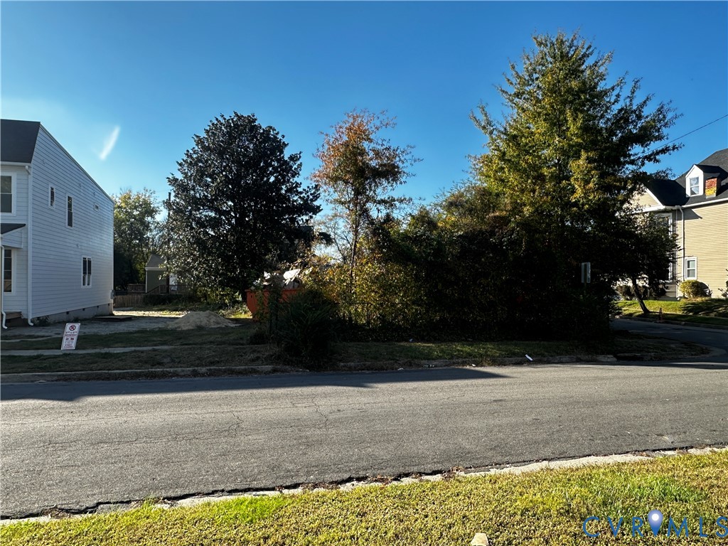 Vacant residential lot featuring established mature trees and direct street access