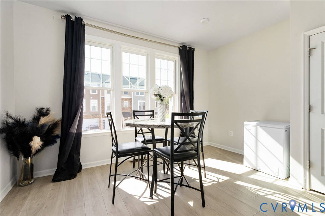 Just off the kitchen, this sun-filled dining area features three large windows, creating a welcoming spot for morning coffee and everyday meals. Just off the kitchen, this sun-filled dining area features three large windows, creating a welcoming spot for morning coffee and everyday meals.