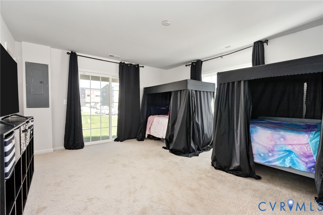 Currently used as a fourth bedroom, this spacious bonus room offers flexibility for a home office, second family room, or recreation room, complete with its own water closet and direct access to the rear patio. Currently used as a fourth bedroom, this spacious bonus room offers flexibility for a home office, second family room, or recreation room, complete with its own water closet and direct access to the rear patio.