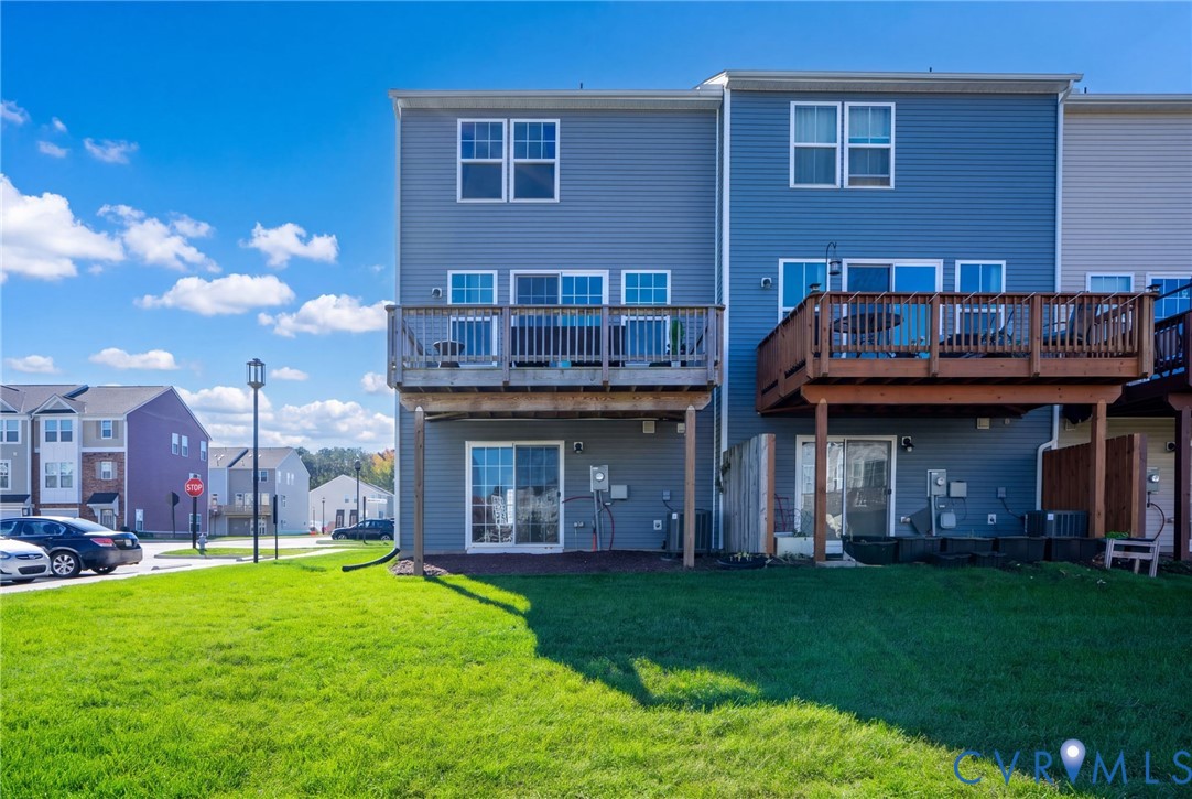 Enjoy outdoor space on two levels, with a deck off the main living area and sliding doors from the first-floor bonus room to the area beneath.