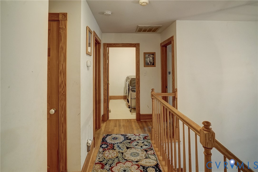 Hallway between Bedrooms, Hardwood Floors