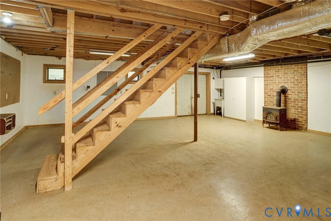 Huge Basement! So many options for this room! Mostly Finished, Heated & Cooled - Great Workshop, Sewing Room/Art Studio - Poured Concrete Floor - Very Solid!