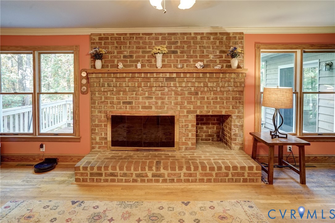 Family Room has Ceiling Fan w/Overhead Light, Crown Moulding, Hardwood Floors