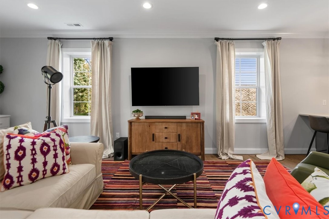 Terrace Level - Neutral interior with recessed lighting, crown molding, and two windows featuring integrated muntins