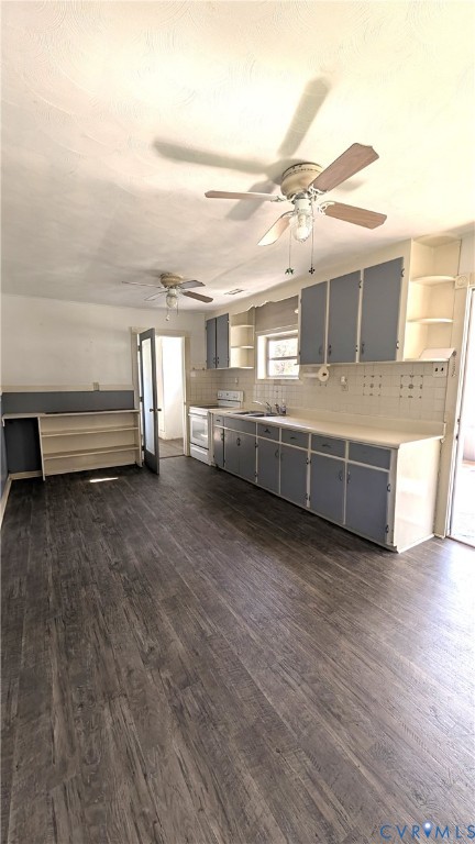 Kitchen featuring wood-finish flooring, two-tone cabinetry with open shelving, tile backsplash, and dual ceiling fans