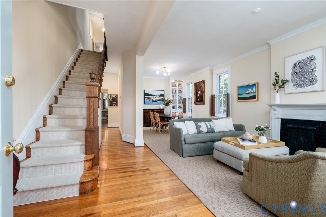 The original staircase, with a new runner, and the long view through the living and dining room. The original staircase, with a new runner, and the long view through the living and dining room.
