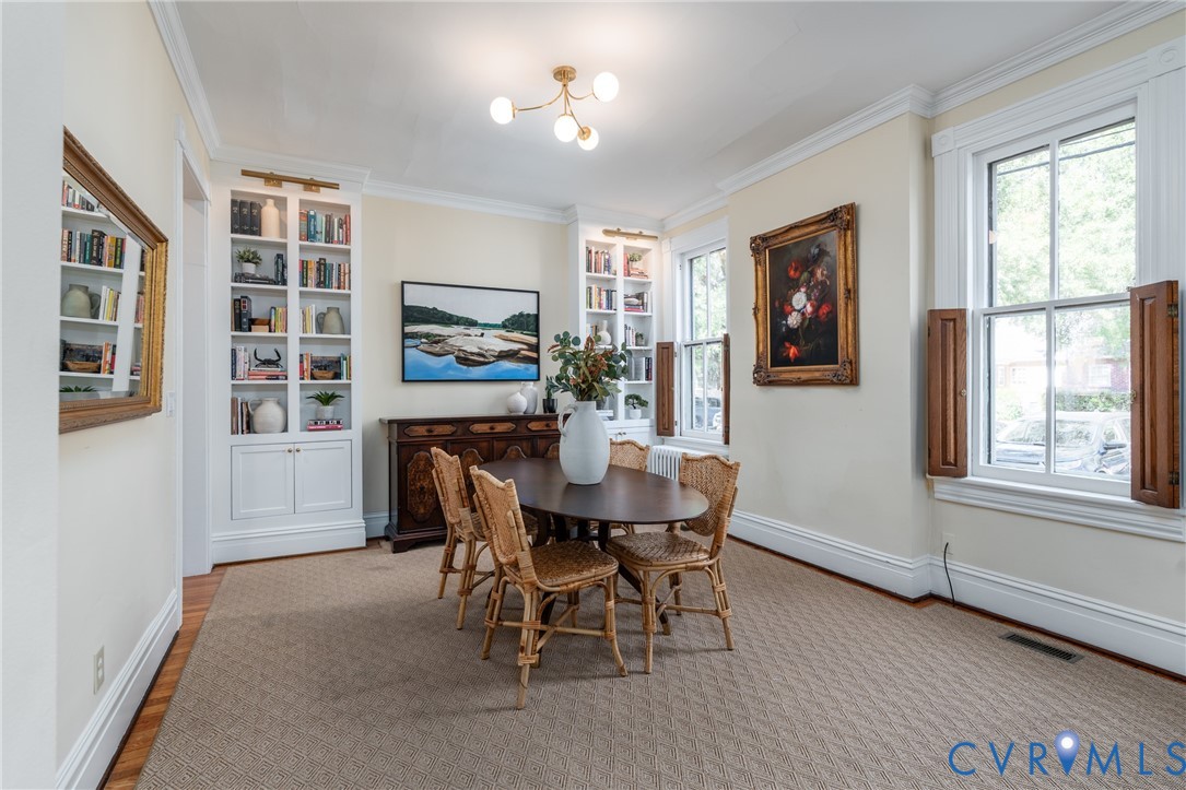 Dining room with side windows and a new chandelier.