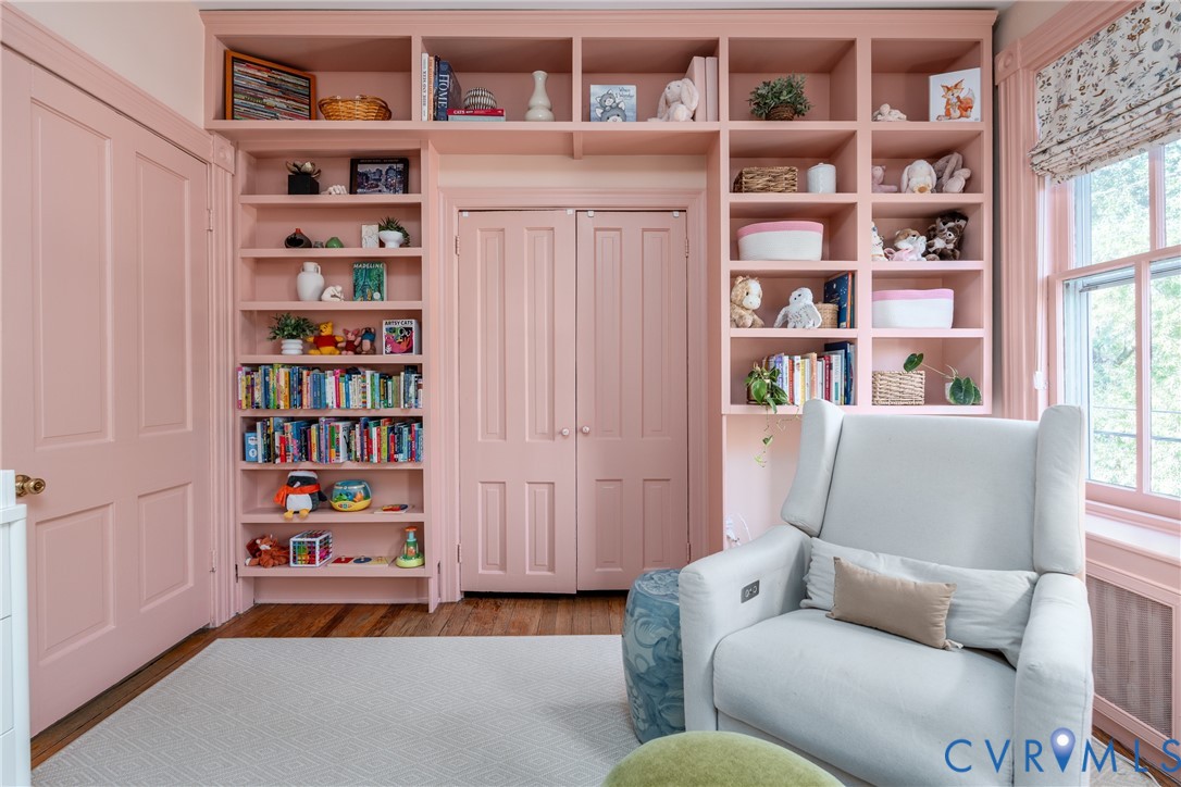 Built-in shelves frame the closet and run above it.