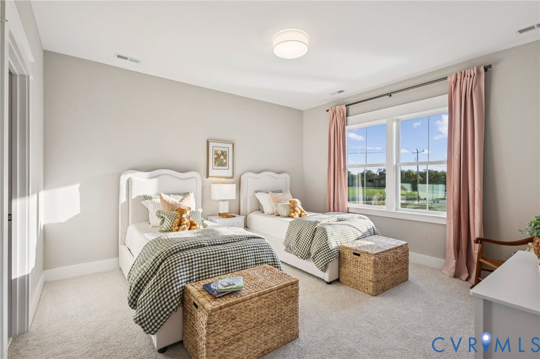 Carpeted room with a double window and a flush-mount ceiling light
