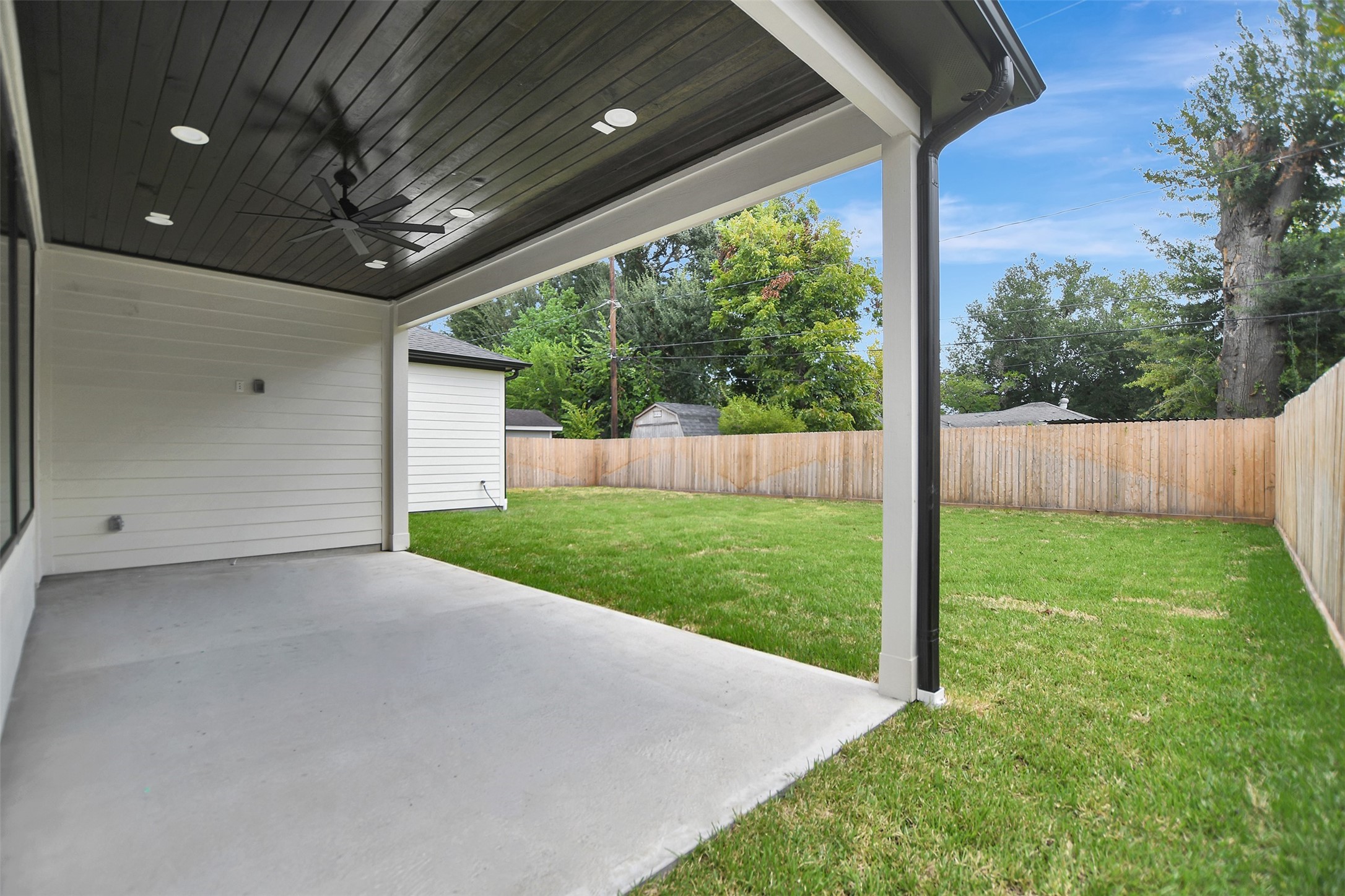 COVERED PATIO WITH STAINED WOOD CEILING