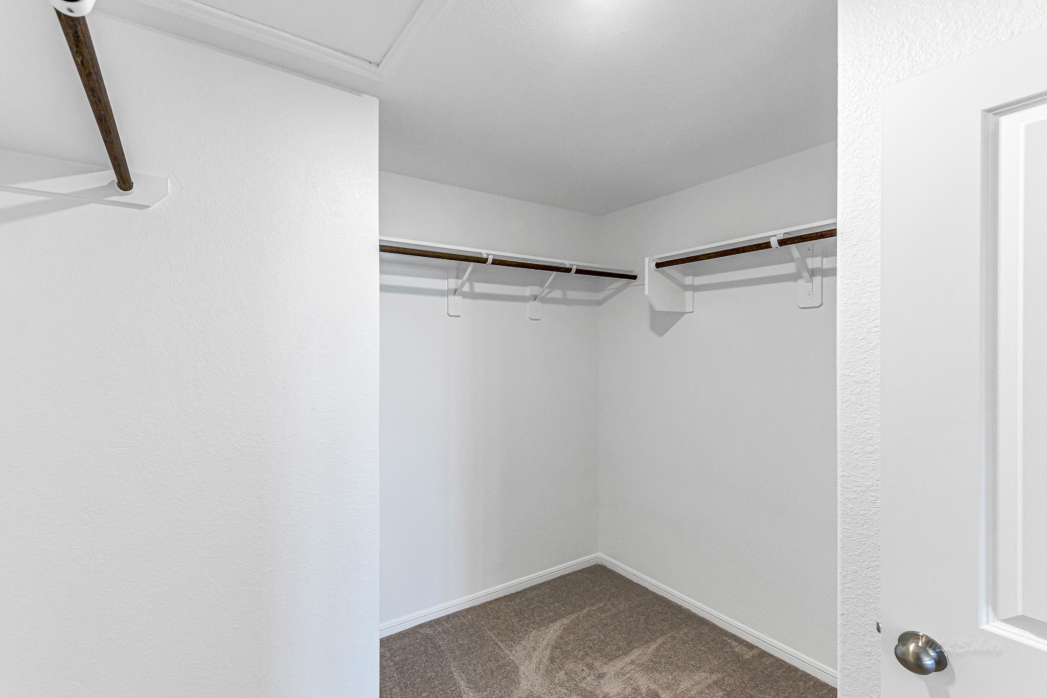 Primary walk-in closet.