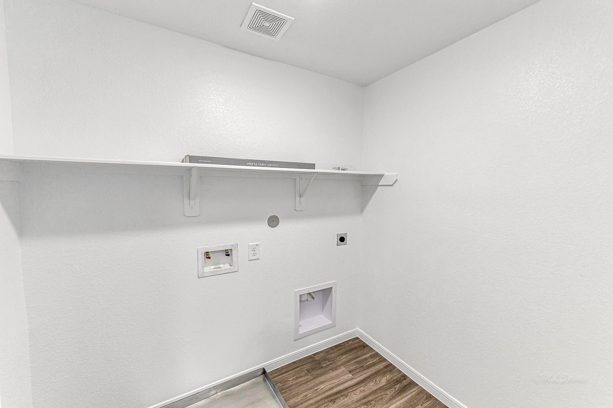 Utility room. BRAND NEW WASHER AND DRYER TO BE INSTALLED PRIOR TO MOVE IN.