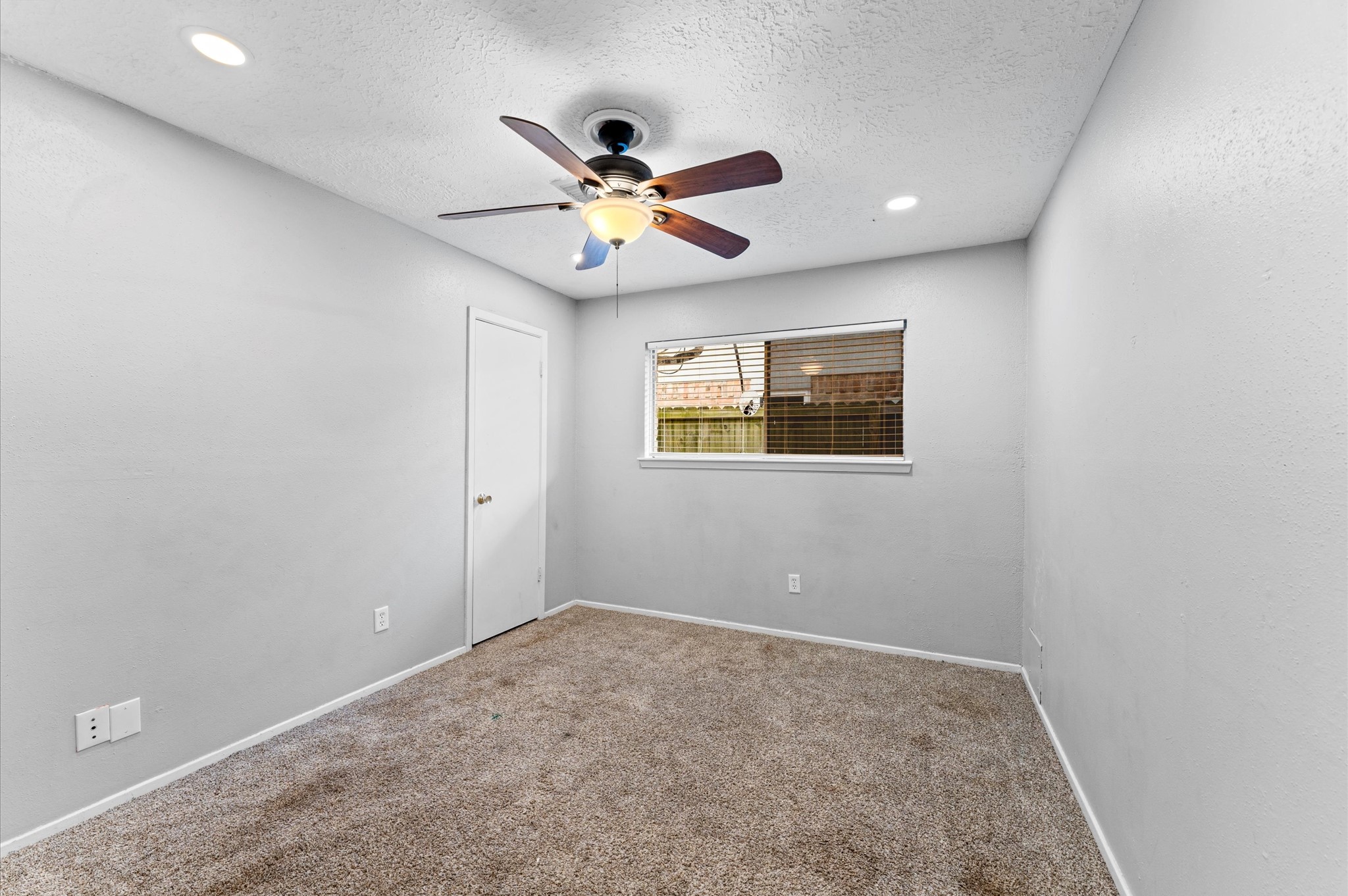 Bedroom 2 offers a comfortable space for any family member or guest. It also has a walk-in closet.