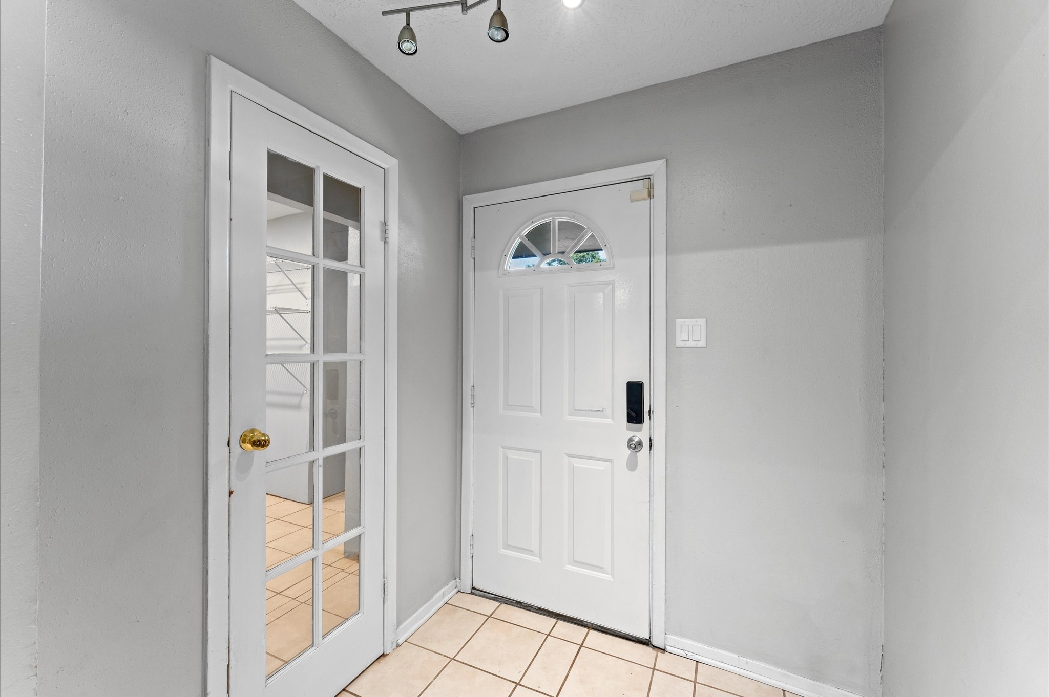 As you step inside, to the right you'll see a doorway that leads to a large laundry room as well as an added flex space or additional bedroom.