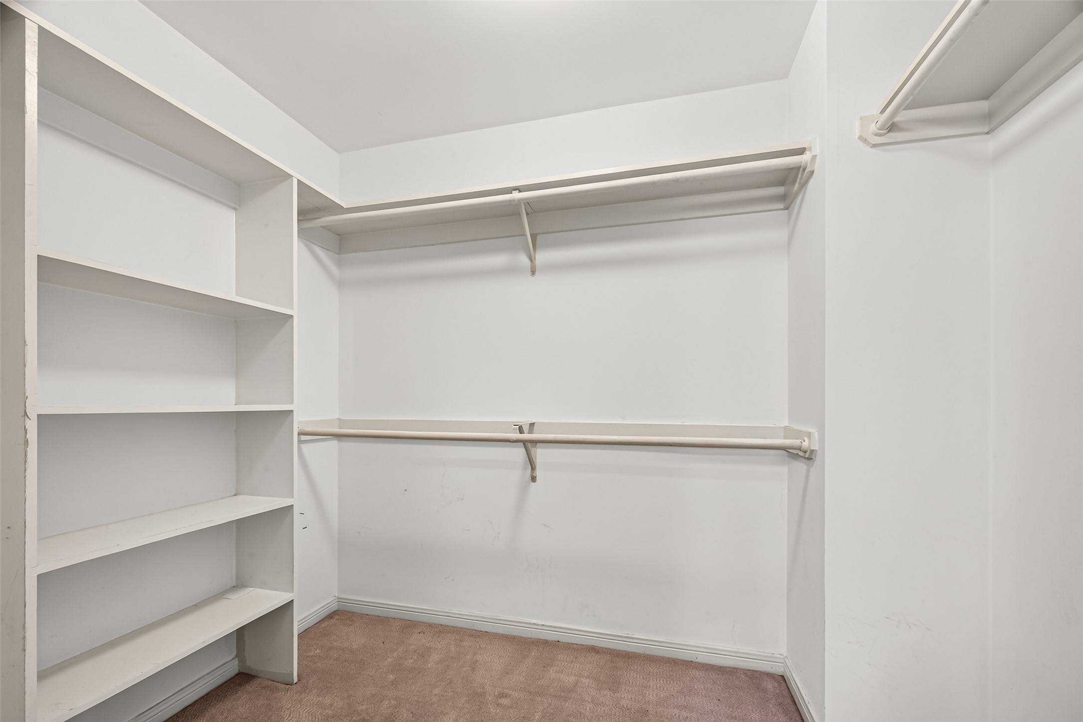 Spacious walk in closet in primary bedroom