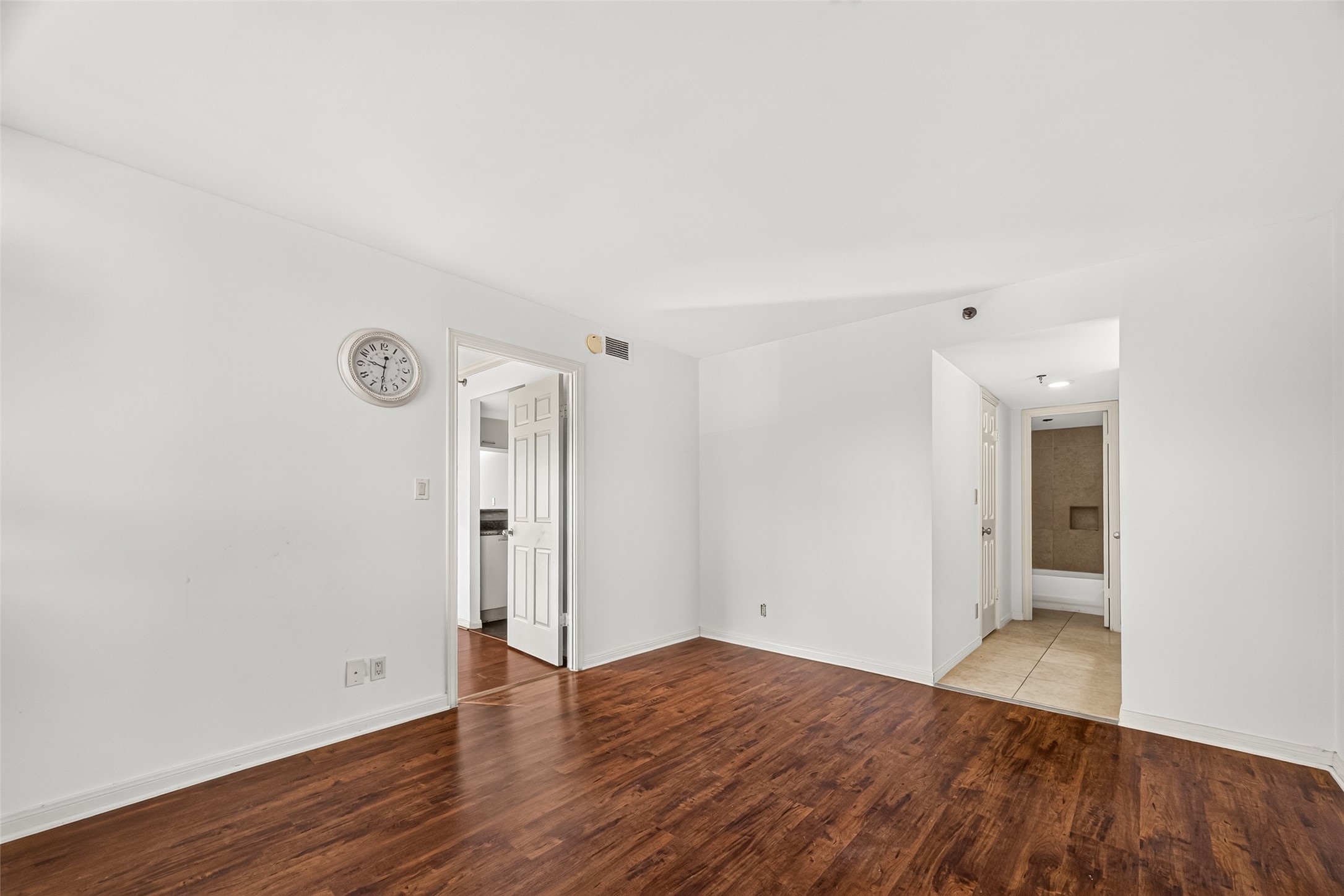 View of primary bedroom & full primary bathroom with walk in closet