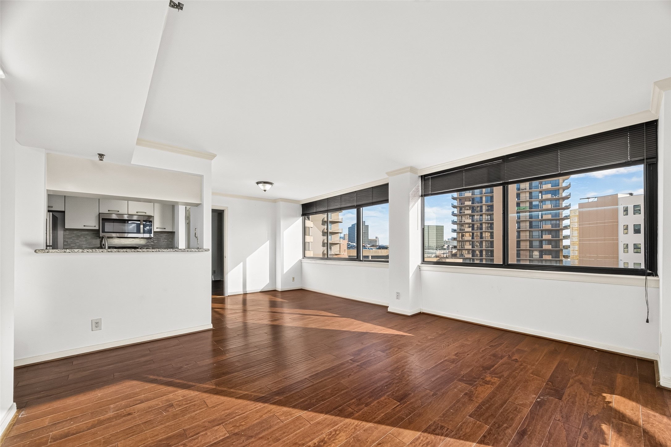 Another view of living room, dining room & kitchen