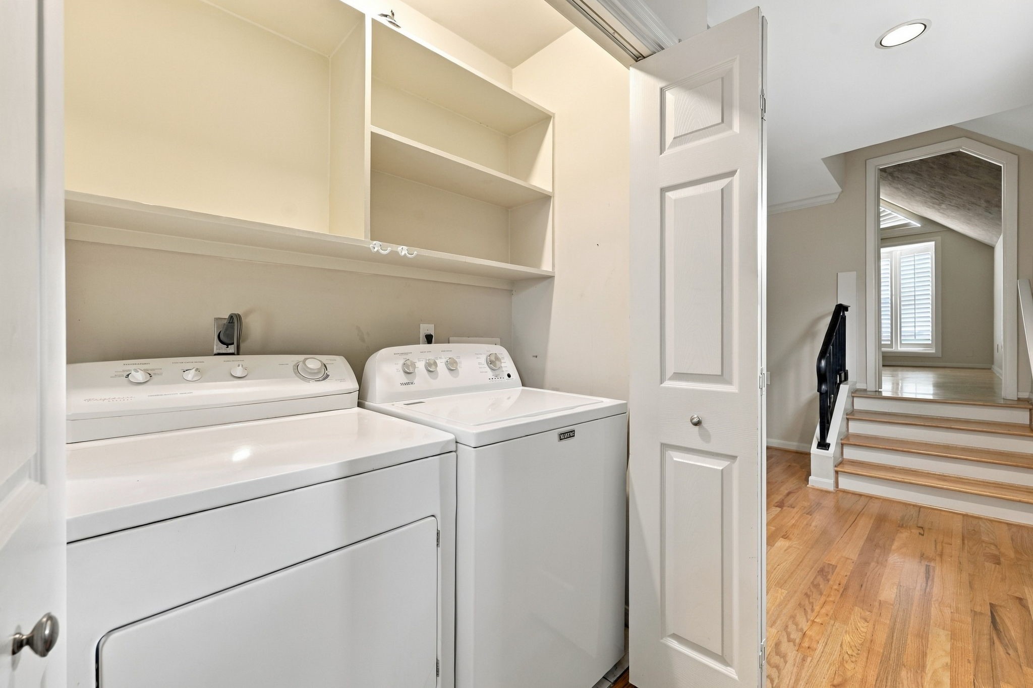 2nd Floor: Utility Room and stairs to primary bedroom.