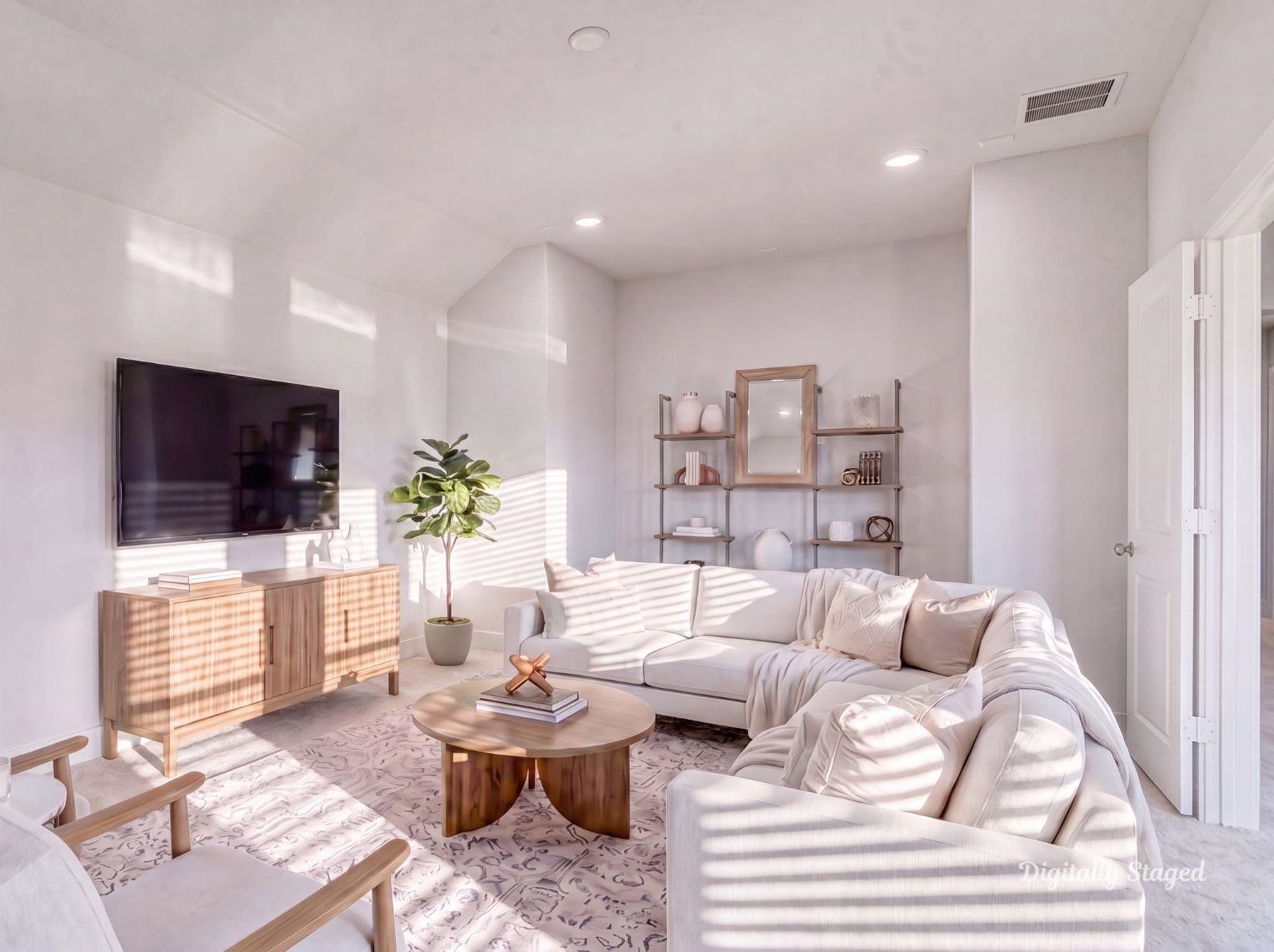 A bright and spacious upstairs media
room or second living area featuring
double doors that open to an
adjacent flexible space, soft
carpeting, and recessed lighting.
This photo has been digitally staged
to illustrate the possibilities of the
homes aesthetic and potential
design. Some furnishings and dcor
shown are for visual inspiration.