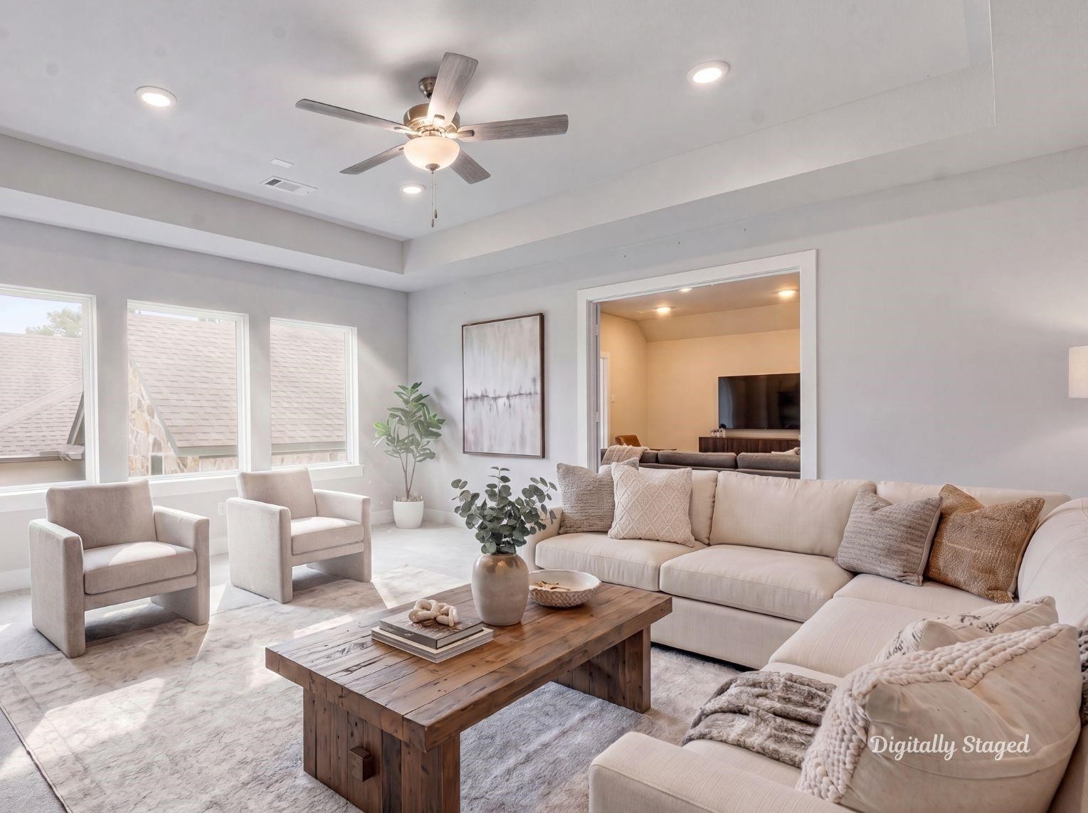 An expansive upstairs game room or
second living area featuring a tray
ceiling, plush carpeting, and direct
access to an adjacent media room.
This photo has been digitally staged
to illustrate the possibilities of the
homes aesthetic and potential
design. Some furnishings and dcor
shown are for visual inspiration.
