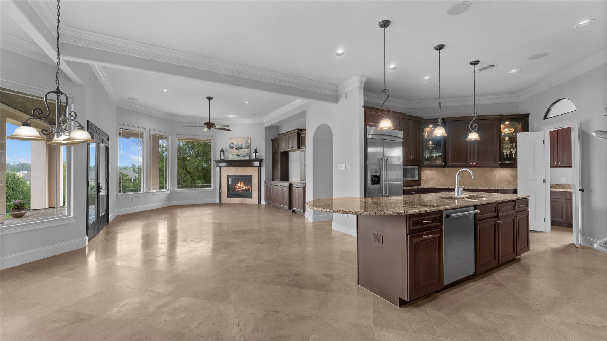 Breakfast area is to the right.  Attached to the kitchen is a family room with a gas fireplace.  Also attached is a guest room with an ensuite bathroom.